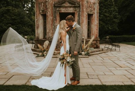 Groom Kissing Bride At Larmer Tree