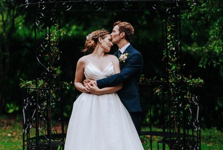 Groom Kissing Bride Shot At Larmer Tree